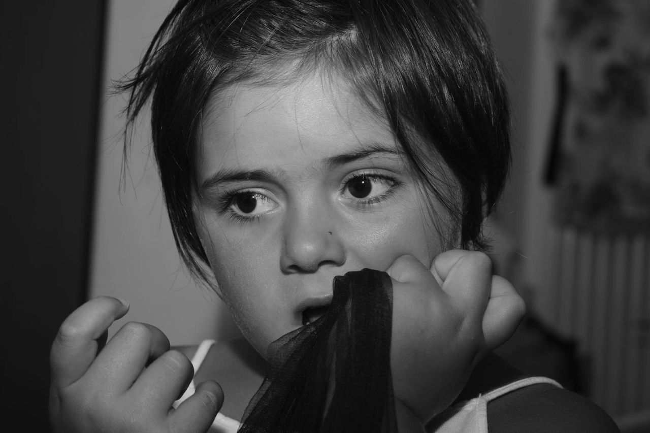 CLOSE-UP PORTRAIT OF GIRL WITH HAIR AT HOME