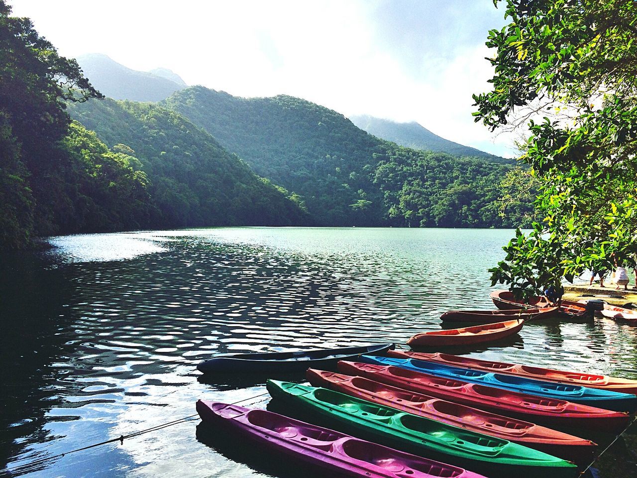 mountain, water, beauty in nature, scenics, lake, tranquility, day, nature, nautical vessel, outdoors, no people, sky, tranquil scene, pedal boat, swan