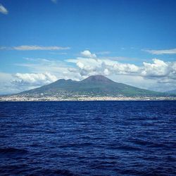 Scenic view of mountains against cloudy sky