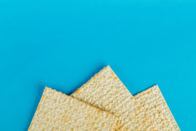 Low angle view of wall against blue sky