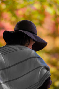 Rear view of woman wearing hat