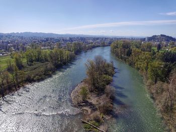 Scenic view of river in forest against sky