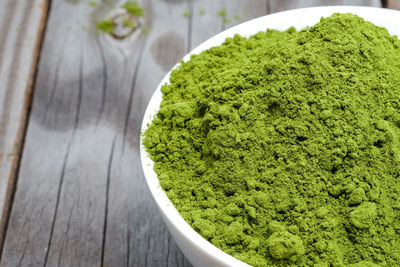 Close-up of green bowl on table
