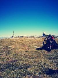 Surface level of land against clear blue sky