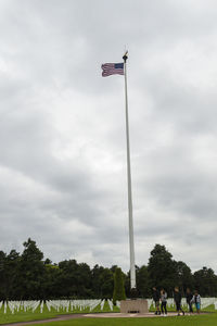 Scenic view of flag against sky