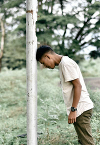 Side view of young man looking away