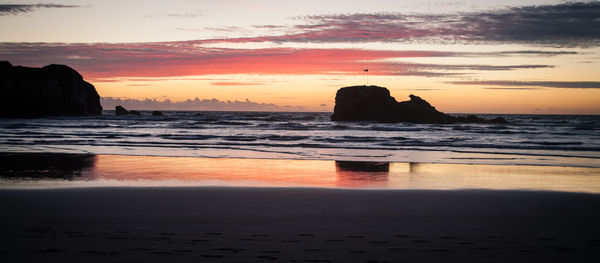 Scenic view of sea at sunset