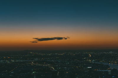 High angle view of illuminated buildings against sky during sunset