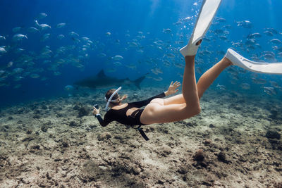 High angle view of man swimming in sea