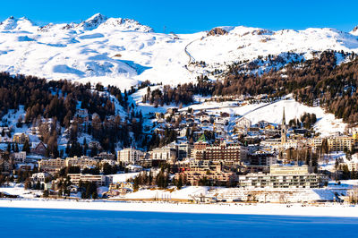 The town and lake of santk moritz in winter. engadin, switzerland.