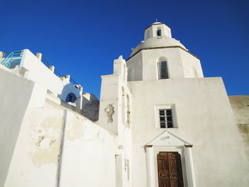 Low angle view of building against blue sky