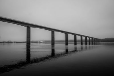 The vejle fjord bridge in foggy weather, denmark