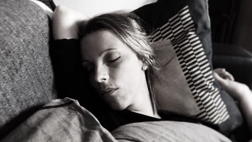 Close-up of young woman relaxing at home