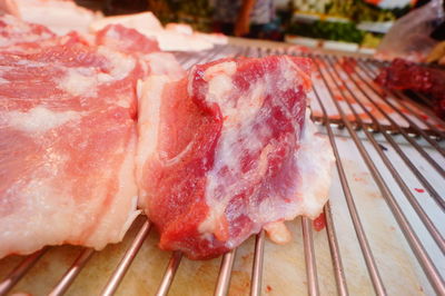 High angle view of meat on barbecue grill