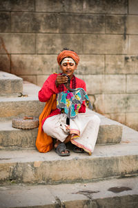 Portrait of woman sitting on steps