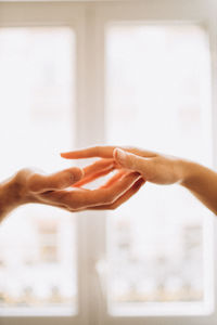 Cropped hand of woman holding hands