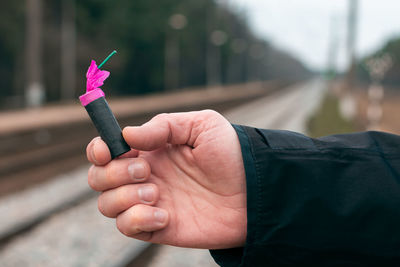 Close-up of man holding hands