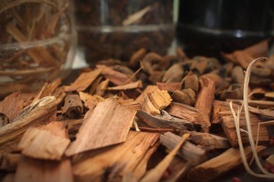 Close-up of firewood in container