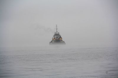 Boat in sea against sky