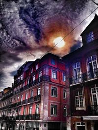 Low angle view of building against cloudy sky