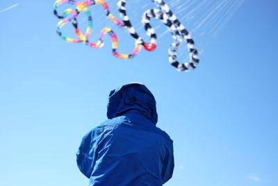 Low angle view of balloons against blue sky