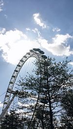 Low angle view of ferris wheel against sky