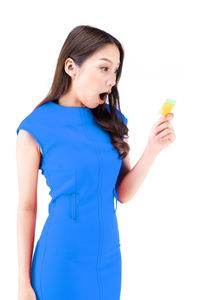 Young woman standing against white background