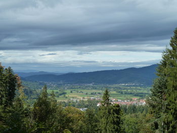 High angle view of trees and mountains against sky