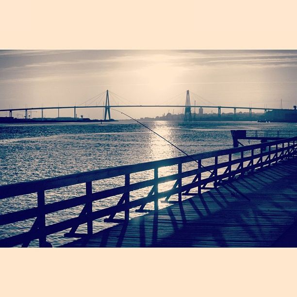 sea, water, railing, horizon over water, sky, built structure, bridge - man made structure, connection, architecture, scenics, tranquil scene, pier, tranquility, nature, beauty in nature, bridge, ocean, sunlight, rippled, beach