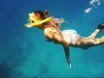 Woman swimming in sea