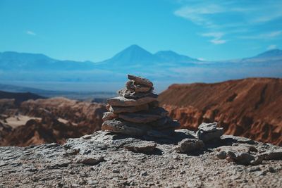 Pile of stones with mountain in background