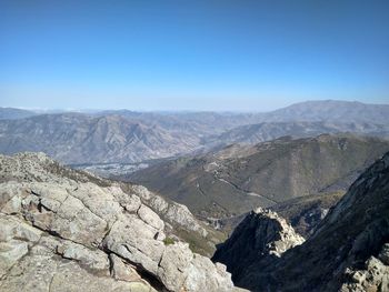 Scenic view of mountains against clear blue sky