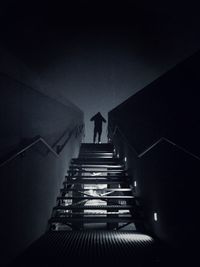 Low angle view of man on staircase