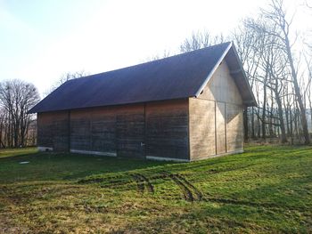 Old house on grassy field