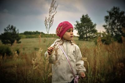 Girl standing on field