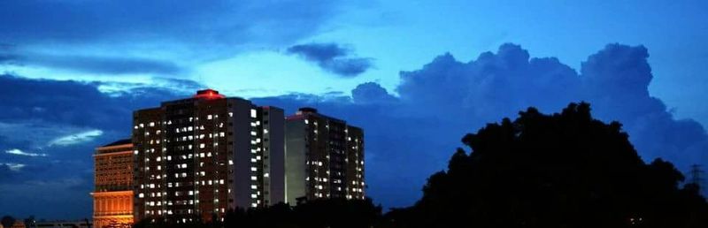 Low angle view of building against cloudy sky