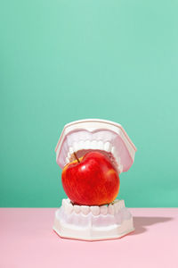 Ice cream cone on table against white background