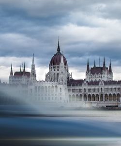 Historic building against cloudy sky