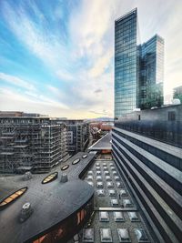 Modern buildings in city against sky