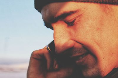 Close-up portrait of young man looking away