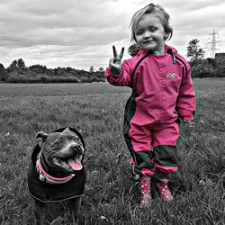 Girl with dog on field