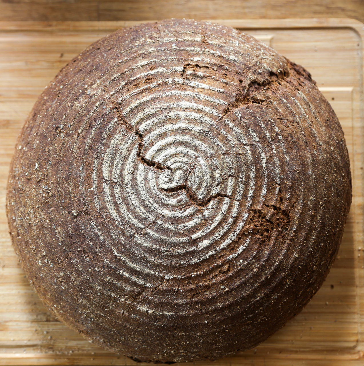 DIRECTLY ABOVE SHOT OF SPIRAL ON WOODEN TABLE