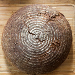 High angle view of spiral on wooden table