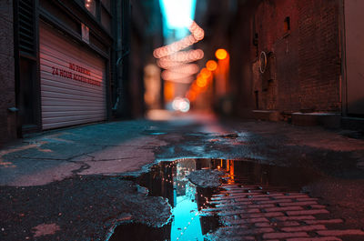 Illuminated city street at dusk