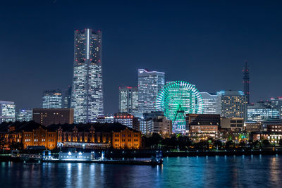 Illuminated buildings at waterfront