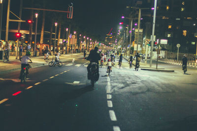 People crossing road at night