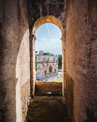 Ancient roman arch seen through arch window