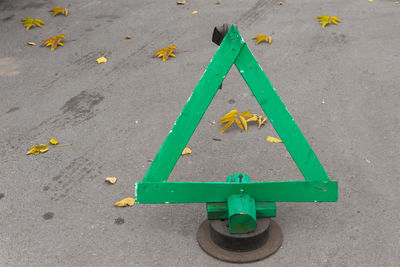 High angle view of arrow sign on road