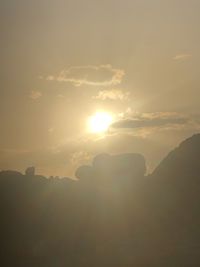 Scenic view of silhouette mountain against sky during sunset