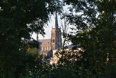 Low angle view of bell tower against sky